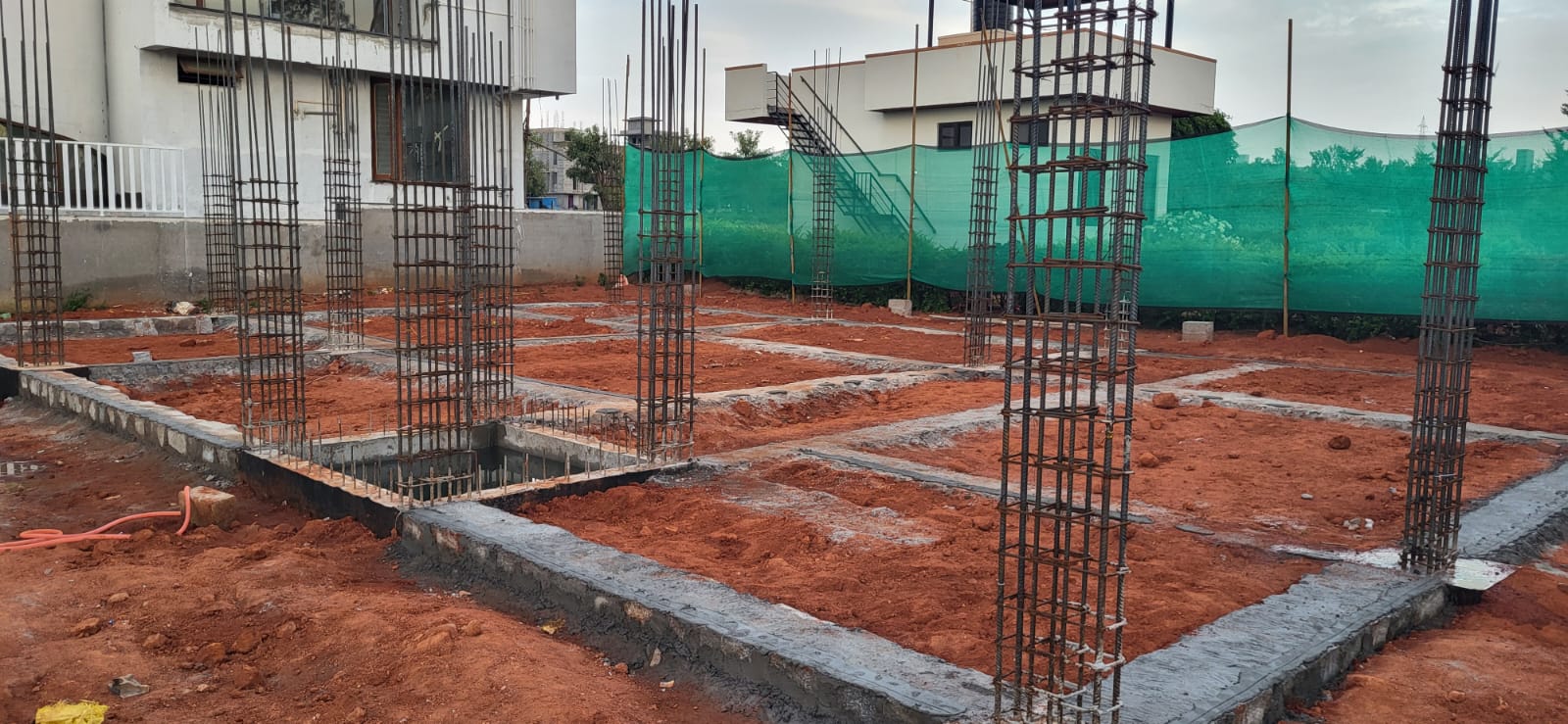 Actual ADC construction site showing foundation work and column reinforcement