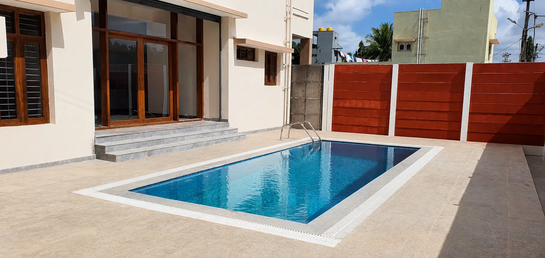 Completed private residential swimming pool and courtyard by ADC